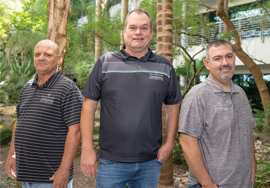 The leadership team of Hitt Concrete & Site Construction, Inc. (from left to right): David Strause, Striping & Signage/SWPPP/Operations Manager; Paul Hitt, President; and Robert Greene, Senior Director of Concrete Operations.